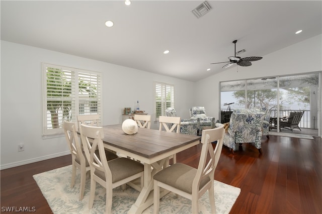 dining space featuring lofted ceiling, dark hardwood / wood-style floors, and ceiling fan