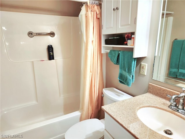 full bathroom with vanity, toilet, and shower / bath combo with shower curtain