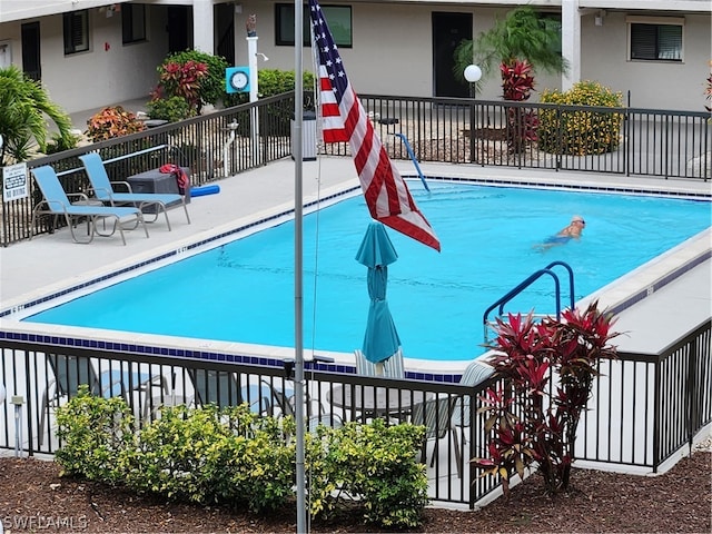 view of swimming pool with a patio area