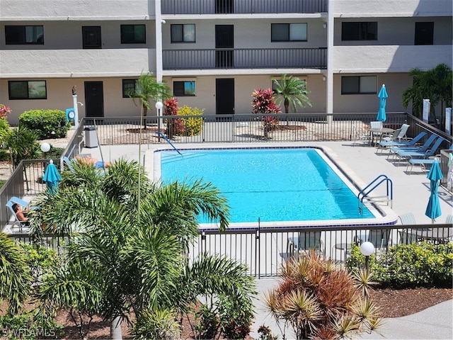 view of swimming pool with a patio