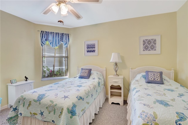 bedroom featuring light carpet and ceiling fan