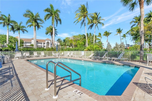 view of swimming pool with a patio