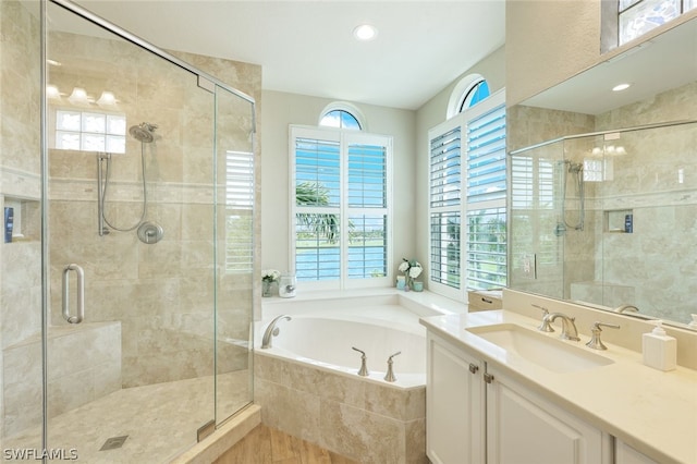 bathroom with vanity and plus walk in shower