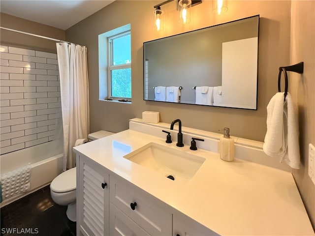 full bathroom with toilet, shower / tub combo, and vanity with extensive cabinet space