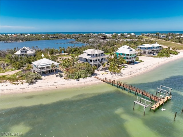 bird's eye view with a view of the beach and a water view