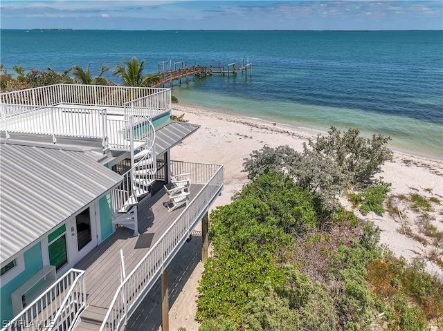 drone / aerial view with a water view and a view of the beach