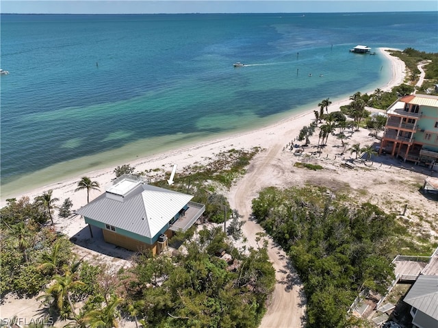 birds eye view of property featuring a view of the beach and a water view