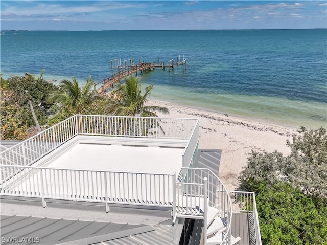 water view featuring a dock and a view of the beach