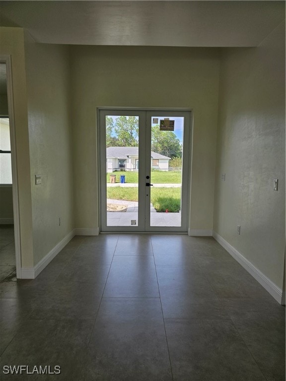 spare room featuring french doors