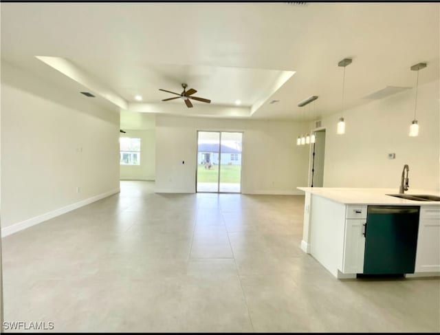 kitchen with white cabinets, decorative light fixtures, sink, and dishwasher