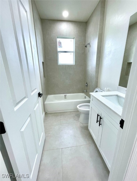 full bathroom featuring tile patterned flooring, vanity, toilet, and tiled shower / bath combo