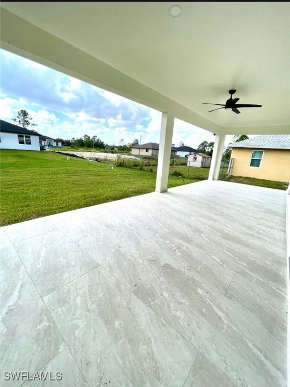 view of patio / terrace featuring ceiling fan