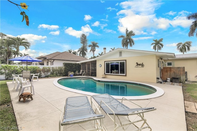 view of swimming pool with a patio