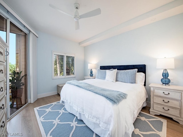 bedroom featuring access to exterior, light hardwood / wood-style flooring, and ceiling fan