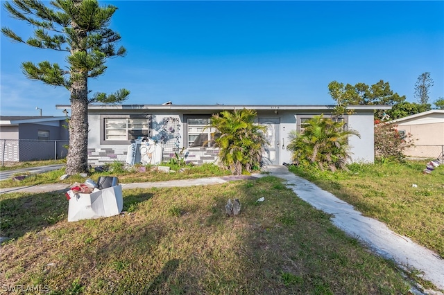 ranch-style house with a front yard