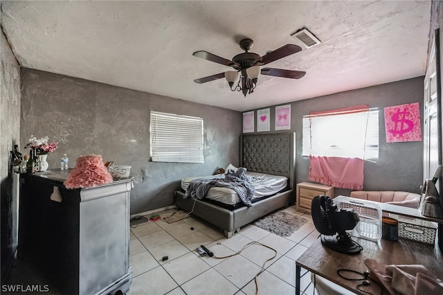 bedroom featuring light tile floors and ceiling fan