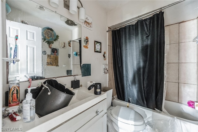 full bathroom with toilet, vanity, and shower / tub combo with curtain