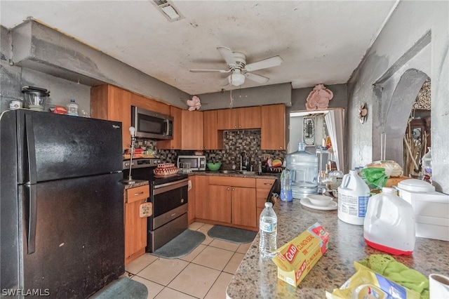 kitchen with light tile floors, ceiling fan, tasteful backsplash, appliances with stainless steel finishes, and sink