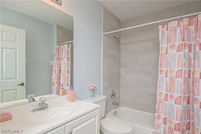 full bathroom featuring toilet, shower / tub combo, and vanity