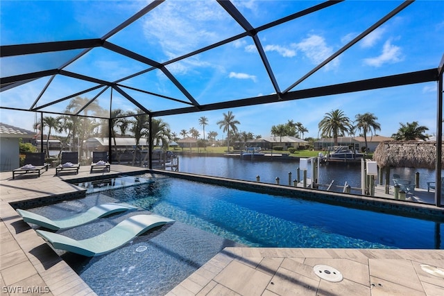 view of swimming pool featuring a water view, a lanai, a hot tub, and a patio area