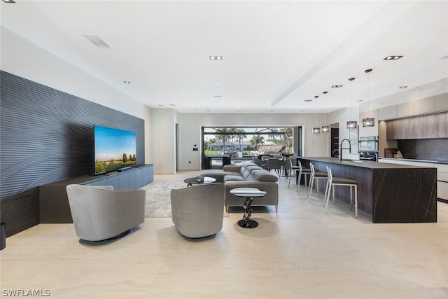 living room featuring sink