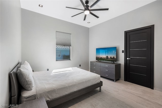 bedroom with ceiling fan and light wood-type flooring