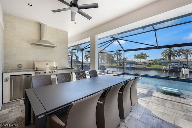 sunroom featuring a swimming pool, a water view, and ceiling fan