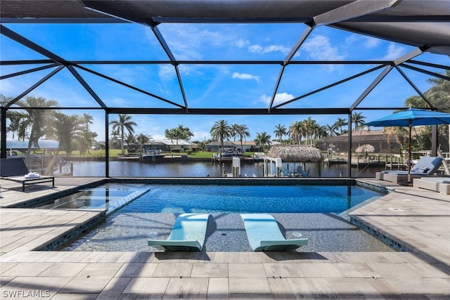 view of pool featuring a water view, a patio area, and a lanai