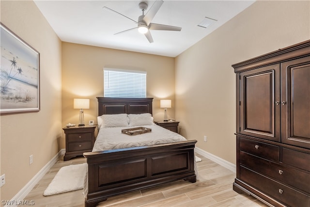 bedroom with ceiling fan and light hardwood / wood-style flooring