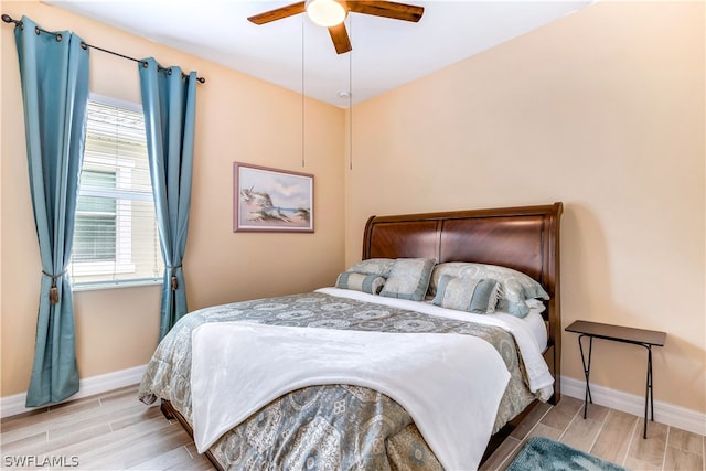 bedroom featuring hardwood / wood-style floors and ceiling fan