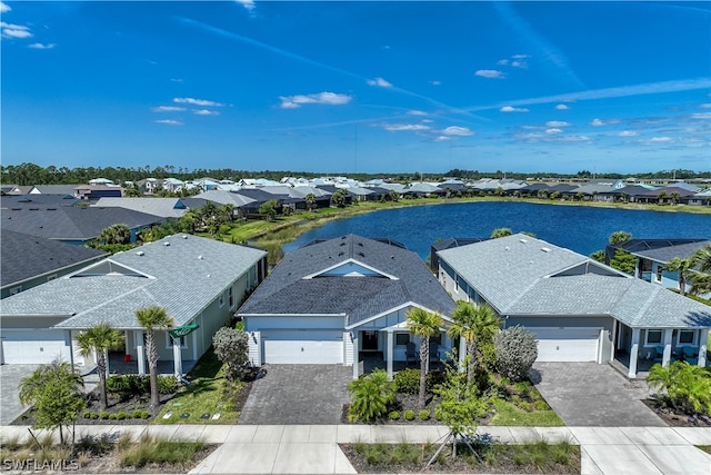 birds eye view of property with a water view