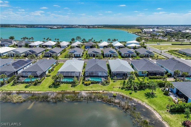 birds eye view of property featuring a water view