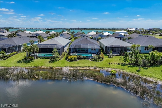 birds eye view of property with a water view