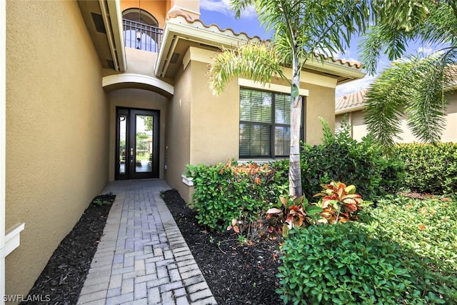 property entrance featuring french doors