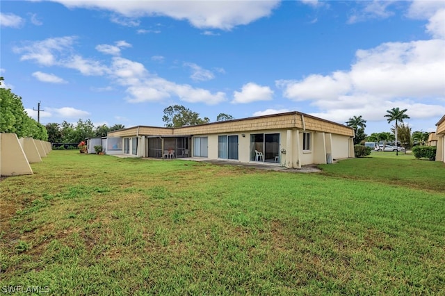 back of house with a yard