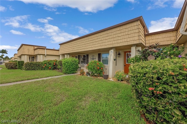 view of front of home with a front yard