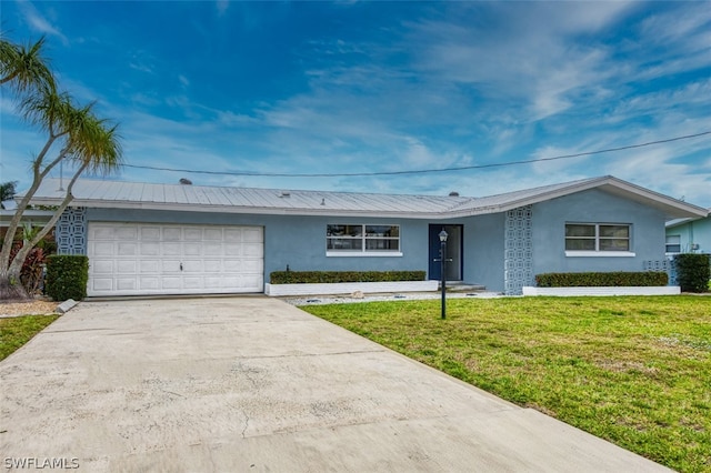 ranch-style home with a garage and a front yard