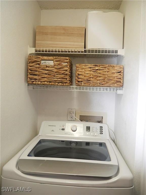 laundry area featuring washer / clothes dryer and laundry area
