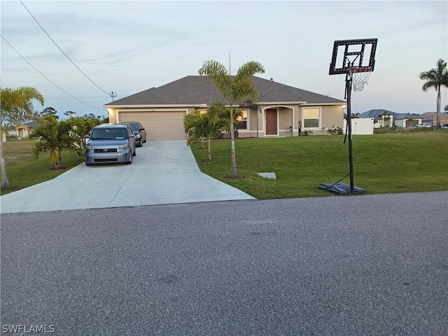 view of front facade with a front yard and a garage