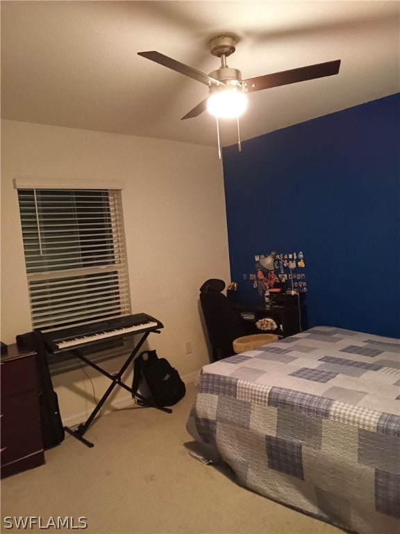 carpeted bedroom featuring ceiling fan