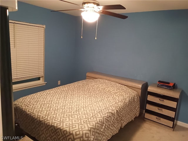 bedroom featuring light carpet and ceiling fan