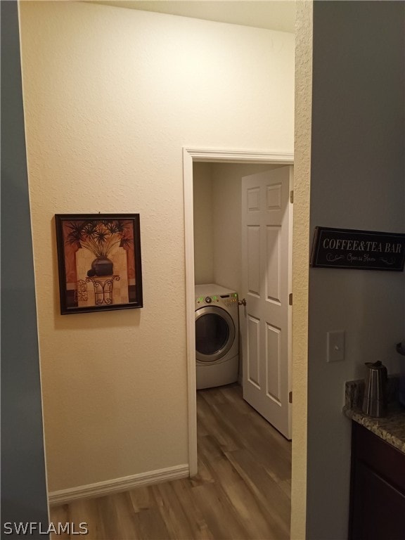 interior space with dark wood-type flooring and washer / clothes dryer