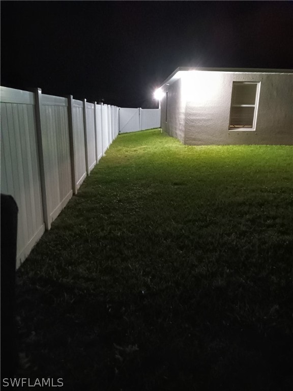 view of yard at night