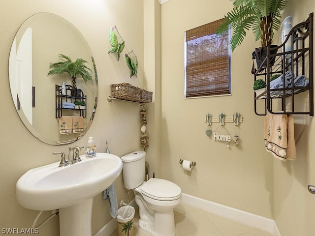 bathroom featuring tile patterned flooring and toilet