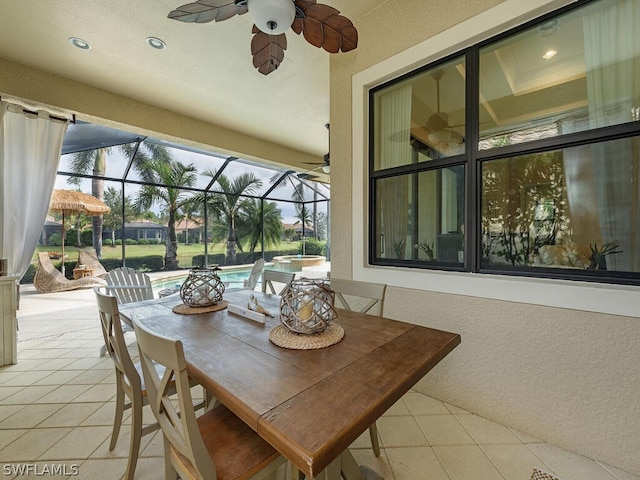 exterior space with plenty of natural light, ceiling fan, and light tile patterned flooring