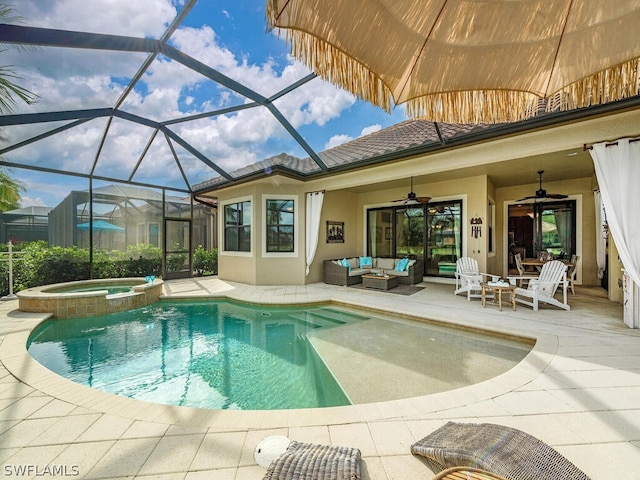 view of swimming pool featuring a lanai, a patio area, an outdoor hangout area, ceiling fan, and an in ground hot tub