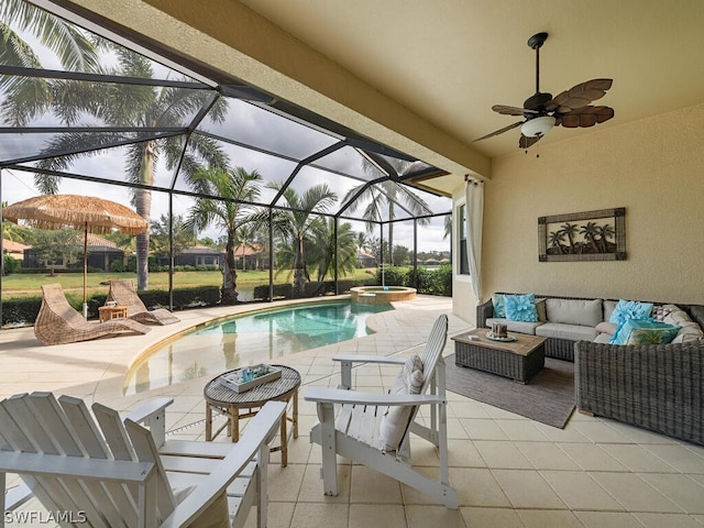 view of pool with an outdoor living space, a lanai, a patio area, and ceiling fan