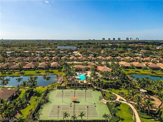 birds eye view of property with a water view