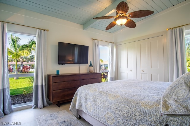 bedroom with multiple windows, ceiling fan, wooden ceiling, and beamed ceiling