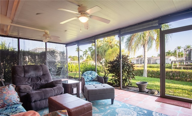 sunroom / solarium featuring ceiling fan